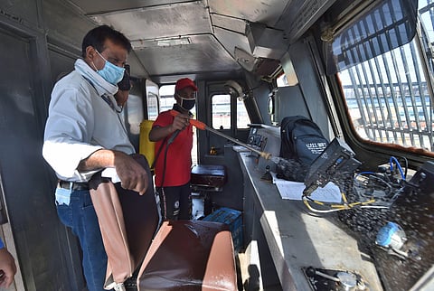 A railway employee sanitizes the driver's cabin of New Delhi-Bilaspur special train at New Delhi Railway Station following the resumption of passenger train services connecting major cities during the ongoing COVID-19 lockdown in New Delhi Tuesday May 12