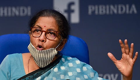 Union Finance Minister Nirmala Sitharaman wearing a face mask gestures as she announces the government's economic package to fight the coronavirus pandemic during a news conference in New Delhi Wednesday May 13 2020. (Photo | PTI)