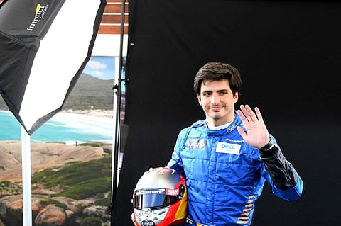 Carlos Sainz Jr poses for a photo at the Albert Park circuit ahead of the Formula One Australian Grand Prix in Melbourne. (Photo | AFP)