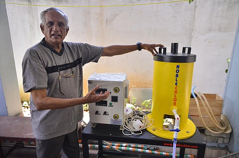 Chennai activist V Santhanam along with the sanitiser plant he has installed in his home (Photo | Debadatta Mallick)