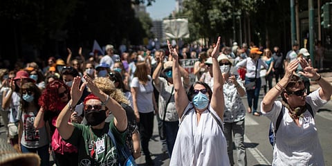 Greek state school teachers and students, wearing masks to prevent the spread of the coronavirus, protest in Athens. (Photo| AP)