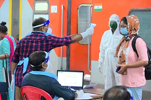 Passengers from the New Delhi - Rajadhani Superfast special screened after getting down at the Thiruvananthapuram Central Railway Station. (Photo | By special arrangement)