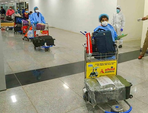 Passengers arrive from Kuwait by an Air India flight at Calicut International Airport during the ongoing COVID-19 lockdown in Kozhikode. (Photo | PTI) | Image used for representational purpose only