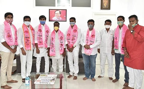 (L-R) Corporators Vikram Goud, Sadhu Sai Vardhan and Battu Raghavendar join TRS in the presence of R&B Minister Prashanth Reddy in Hyderabad on Friday