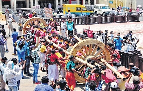Wheels being fixed to an axle at Ratha Khala in Puri on Friday I Express