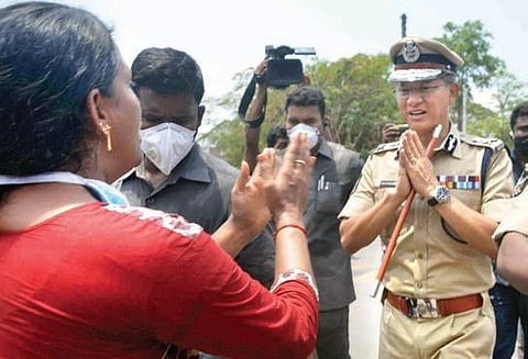 A woman from RR Venkatapuram pleading with DGP Gautam Sawang for help at the LG Polymers plant in Visakhapatnam on Saturday (Photo | EPS)