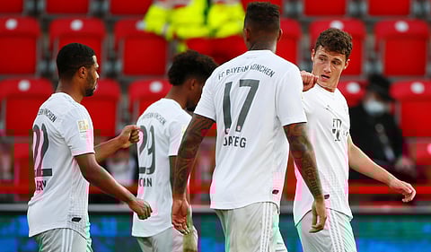 Benjamin Pavard of Bayern (L) celebrates his side's second goal during the German Bundesliga match against Union Berlin in German capital. (Photo | AP)