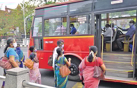 Government staff boarding a MTC bus in Chennai on Monday | DEBADATTA MALLICK