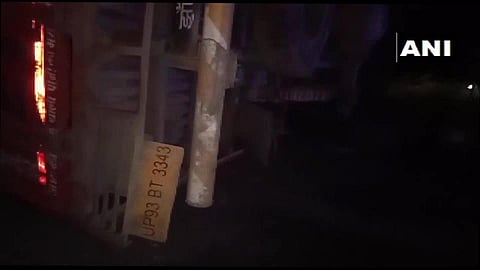 A mini-truck carrying migrant workers overturned on Jhansi-Mirzapur highway in Uttar Pradesh's Mahoba district. (Photo| ANI)