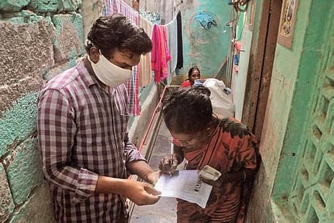 A woman collects her pension in Vijayawada on Friday (Photo | Prasant Madugula, EPS)