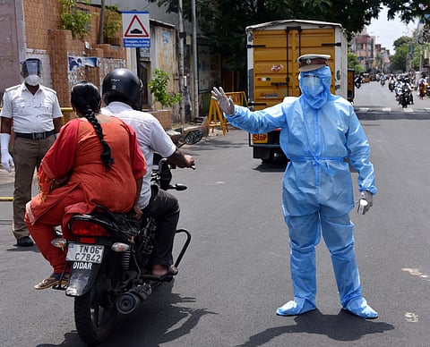 A Traffic Sub-inspector seen wearing a PPE dress during his duty to keep him prevent from corona at Egmore in Chennai (Photo | R Sathish Babu/EPS)
