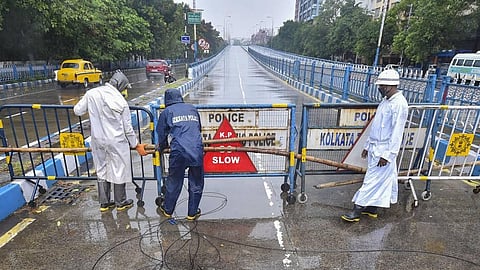 Police personnel seal Park Street flyover ahead of cyclone 'Amphan' landfall in Kolkata Wednesday. (Photo | PTI)