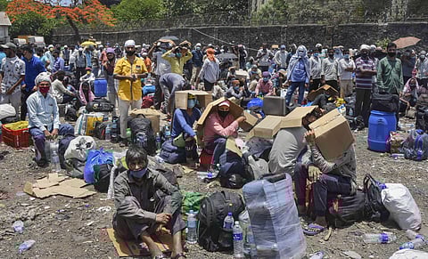 Migrants gather at Dana Bandar to travel back to their hometown after the government eased restrictions during the ongoing COVID-19 lockdown in Mumbai Wednesday May 20 2020. (Photo | PTI)