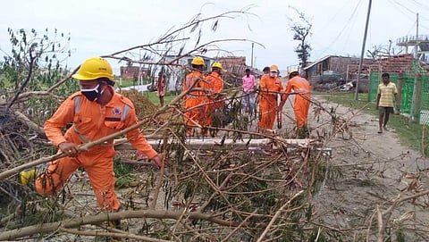 National Disaster Response Force personnel clear rubble in the aftermath of Cyclone Amphan. (Photo | PTI)