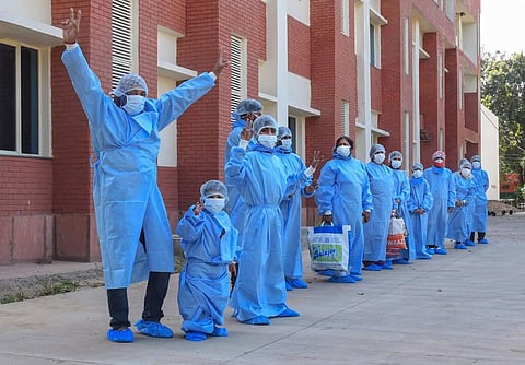 Patients who recovered from COVID-19 pose for photographs after being discharged from PGIMER s hospital during the ongoing lockdown to curb the spread of coronavirus disease in Chandigarh. (Photo | PTI)