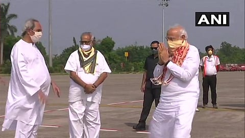 PM Narendra Modi received by CM Naveen Patnaik and Governor Ganeshi Lal on arrival at Bhubaneswar Airport.