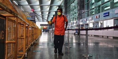 A man disinfects the Bengaluru International airport. (Photo| Shriram BN, EPS)