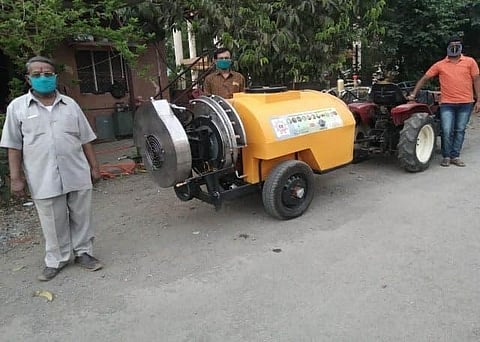 Rajendra Jadhav with the tractor mounted for mass sanitisation. (Photo | Twitter)
