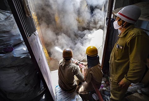 Firefighters douse fire at Delhi shoe factory. (Photo| PTI)