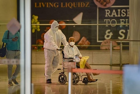 A senior citizen wheeled out from Mumbai international airport. (Photo | PTI)