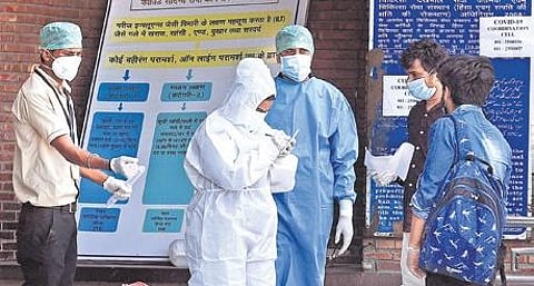 Medical workers in PPE kits.