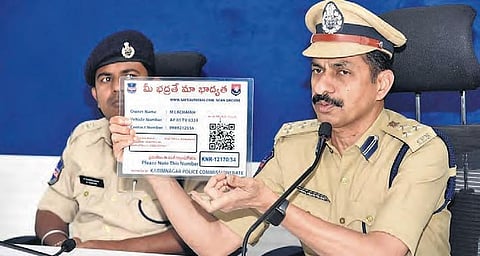 Commissioner of Police VB Kamalasan Reddy explaining how to scan the QR code at an awareness programme in Karimnagar.