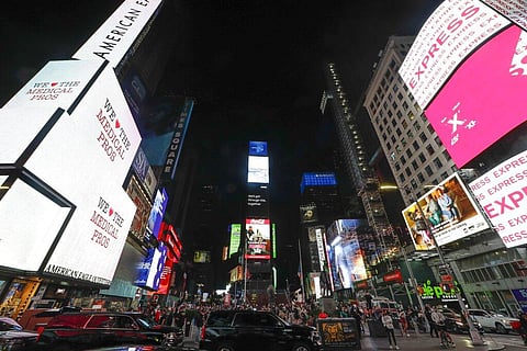 People gather during the coronavirus pandemic in Times Square. (Photo | AP)
