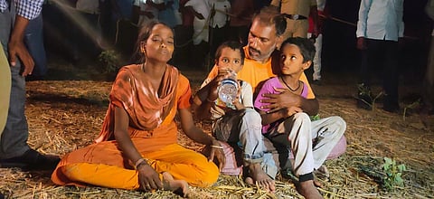 Distraught parents of Sai Vardhan waiting for NDRF personnel to pull their son out of the borewell. The nightlong NDRF operation couldn't save the boy as they could only bring out his lifeless body. (Photo | Express)