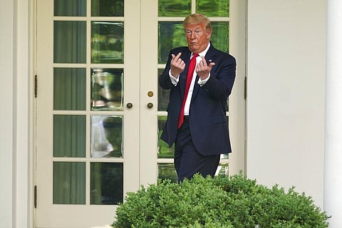 President Donald Trump gestures to people in the audience after an event on protecting seniors with diabetes in the Rose Garden White House. (Photo | AP)