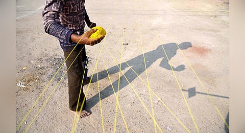 A man prepares manja thread. (File photo | R Satish Babu, EPS)