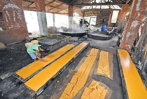 Workers make jaggery at a local unit in Mandya district | UDAYSHANKAR S