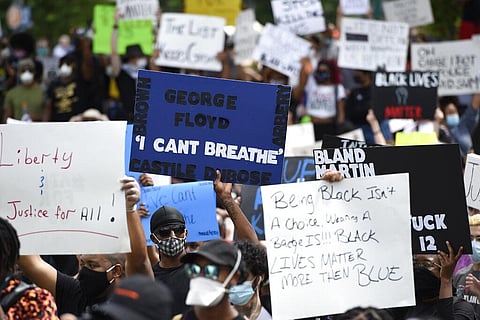 Demonstrators protest in Centennial Olympic Park, Friday, May 29, 2020 in Atlanta. Protests were organized in cities around the United States following the death of George Floyd during an arrest in Minneapolis. (Photo | AP)