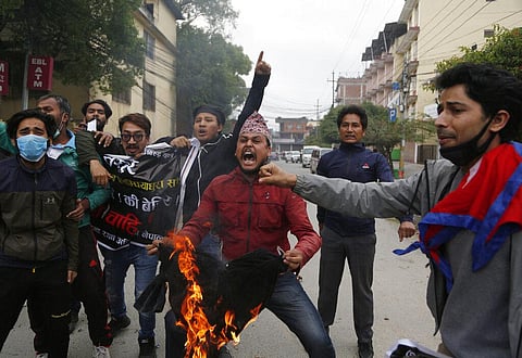 In this Monday, May 11, 2020, file photo, Nepalese students shout slogans during a protest against the Indian government inaugurating a new road through a disputed territory between India and Nepal, in Kathmandu, Nepal. (Photo | AP)