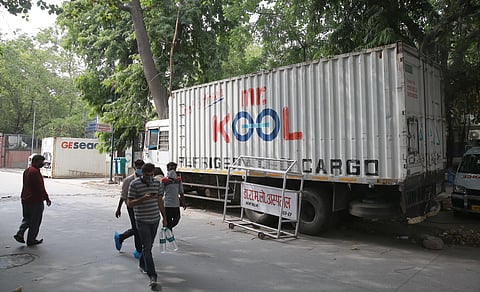 Refrigerated container being placed at RML hospital mortuary to keep dead bodies on Saturday as RML hospital mortuary is facing lack of space for dead bodies during the fourth phase of nationwide lockdown in New Delhi. (Photo | Shekhar Yadav/EPS)