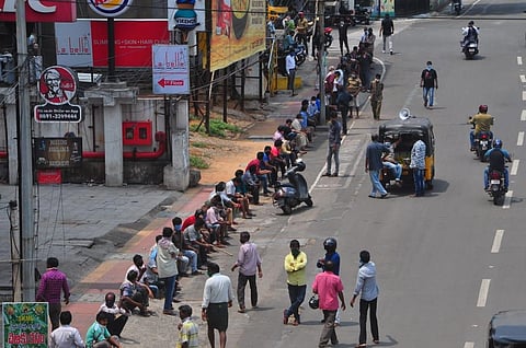 People waiting in front of liquor shops in Visakhapatnam on Monday. (Photo | EPS/G Satyanarayana)
