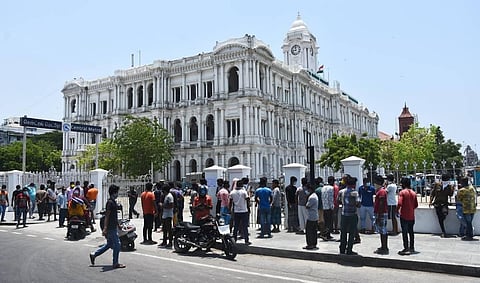 Hundreds of migrant workers gather at Ripon Building in Chennai to get a travel pass on Saturday. (Photo | Ashwin Prasath, EPS)