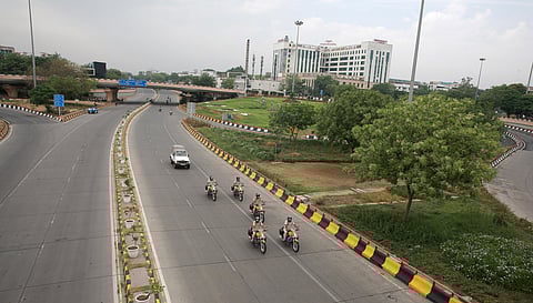 Delhi Police personnel patrol on bikes at AIIMS fiyover during the nationwide lockdown in wake of the coronavirus pandemic in New Delhi on Sunday. (Photo | Shekhar Yadav/EPS)