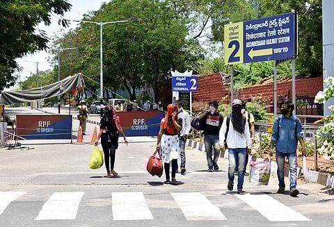 Migrants walking out of Secunderabad railway station after knowing that no train was arranged for them at secunderabad railway station on sunday. (Photo | EPS/S Senbagapandiyan)