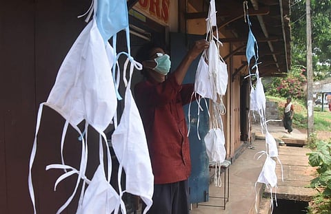 A tailor makes protective masks. (Photo | BP Deepu, EPS)