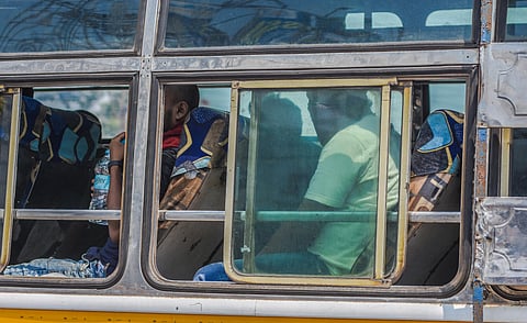 A bus carries migrant labourers from Khordha Road Railway Station to their respective destination in Bhubaneswar on Monday. (Photo | Biswanath Swain)