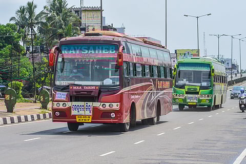 Buses carrying migrant labourers from Khordha Road Railway Station to their respective destination in Bhubaneswar on Monday. (Photo | Biswanath Swain)