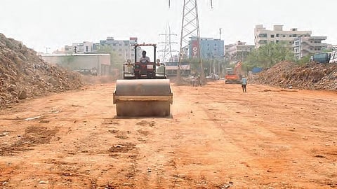 Workers busy laying the new link road from Borabanda to Ayyappa Society near HiTec City on Monday | sathya keerthi