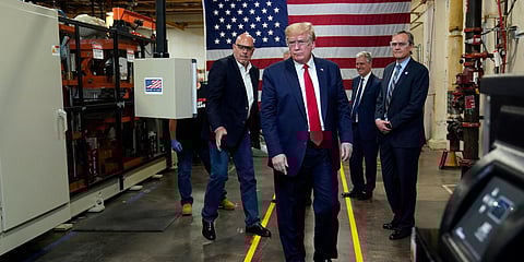 US President Donald Trump participates in a tour of a Honeywell International plant that manufactures personal protective equipment. (Photo| AP)