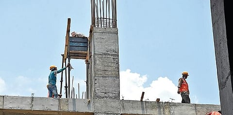 Construction workers at a site at Jubilee Hills in Hyderabad on Wednesday. (Photo| RVK Rao, EPS)