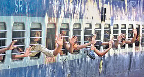 Migrant workers leaving for their home bidding adieu from the railway station ahead of the train’s departure | Manu R Mavelil