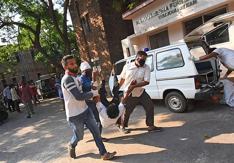 Locals carry a person affected by the chemical gas leak in Visakhapatnam on Thursday morning. (Photo | PTI)