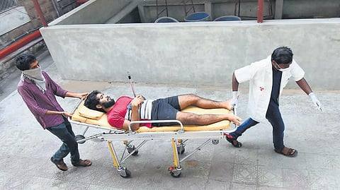 King George Hospital staff shifting a victim of LG Polymers gas leakage I G satyanarayana