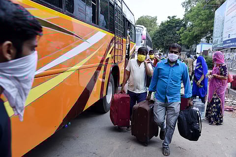 Workers hailing from Rajasthan who were employed in shops in Sowcarpet and Broadway seen boarding into a bus bound to Jodhpur. (Photo | R Sathish Babu/EPS)
