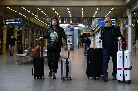 Passngers wearing a facemask arrive at the Eurostar terminal at St Pancras station in London. (Photo | AFP)