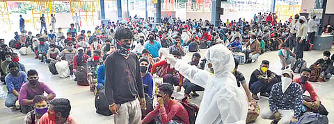 Thermal screening of migrants arriving from Gujarat being conducted at Prayagraj railway station in Uttar Pradesh | PTI